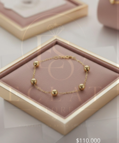 pulsera delgada con esferas doradas