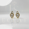 aretes tipo topo con diseño de cruz y circonias